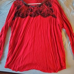 Long sleeved red tunic with black lace detail